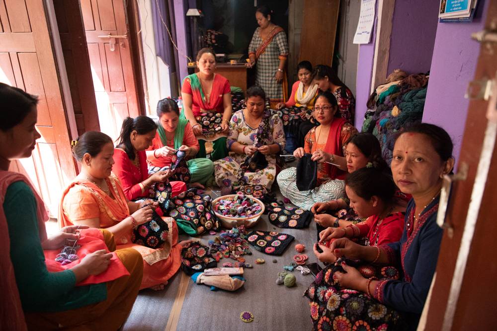 Women garment makers hand-sewing ethical fashion clothing together in Nepal