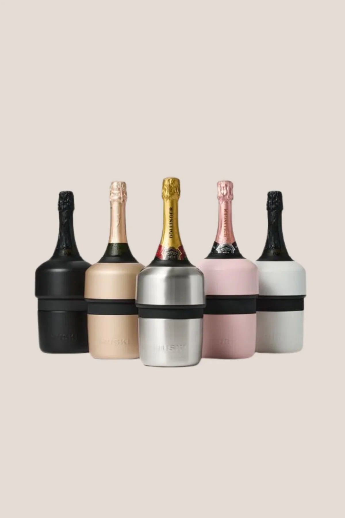 Set of five champagne bottles with black and silver coolers on a beige background
