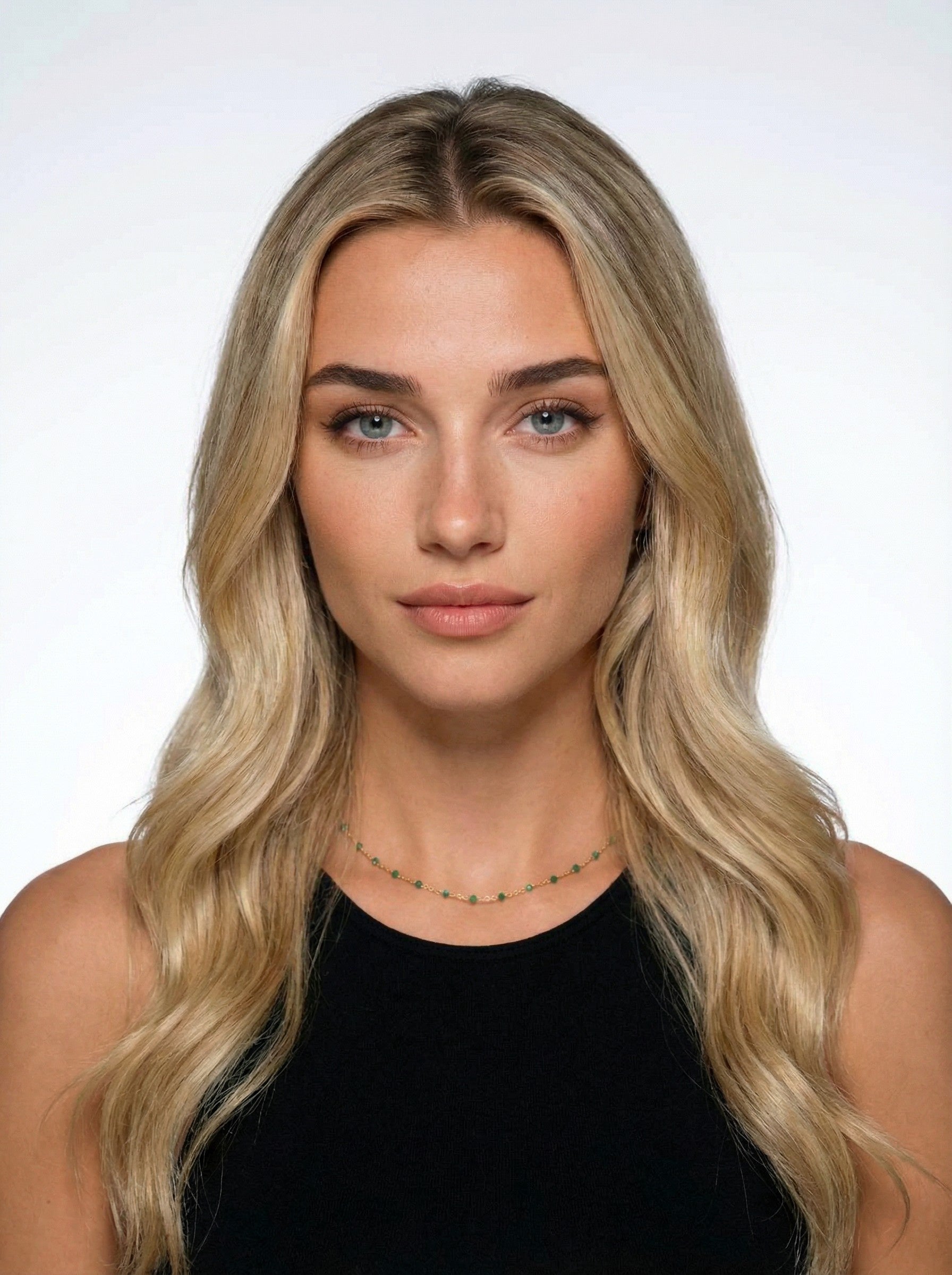 Woman with long blonde hair wearing Aqua Satellite necklace