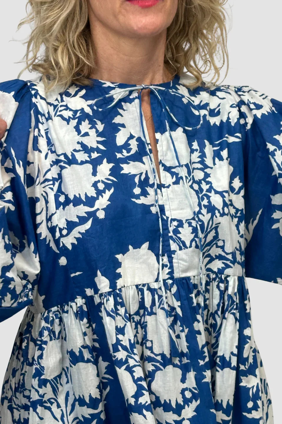 Woman wearing a bBlue Meadow Midi Dress with 3/4 sleeves.