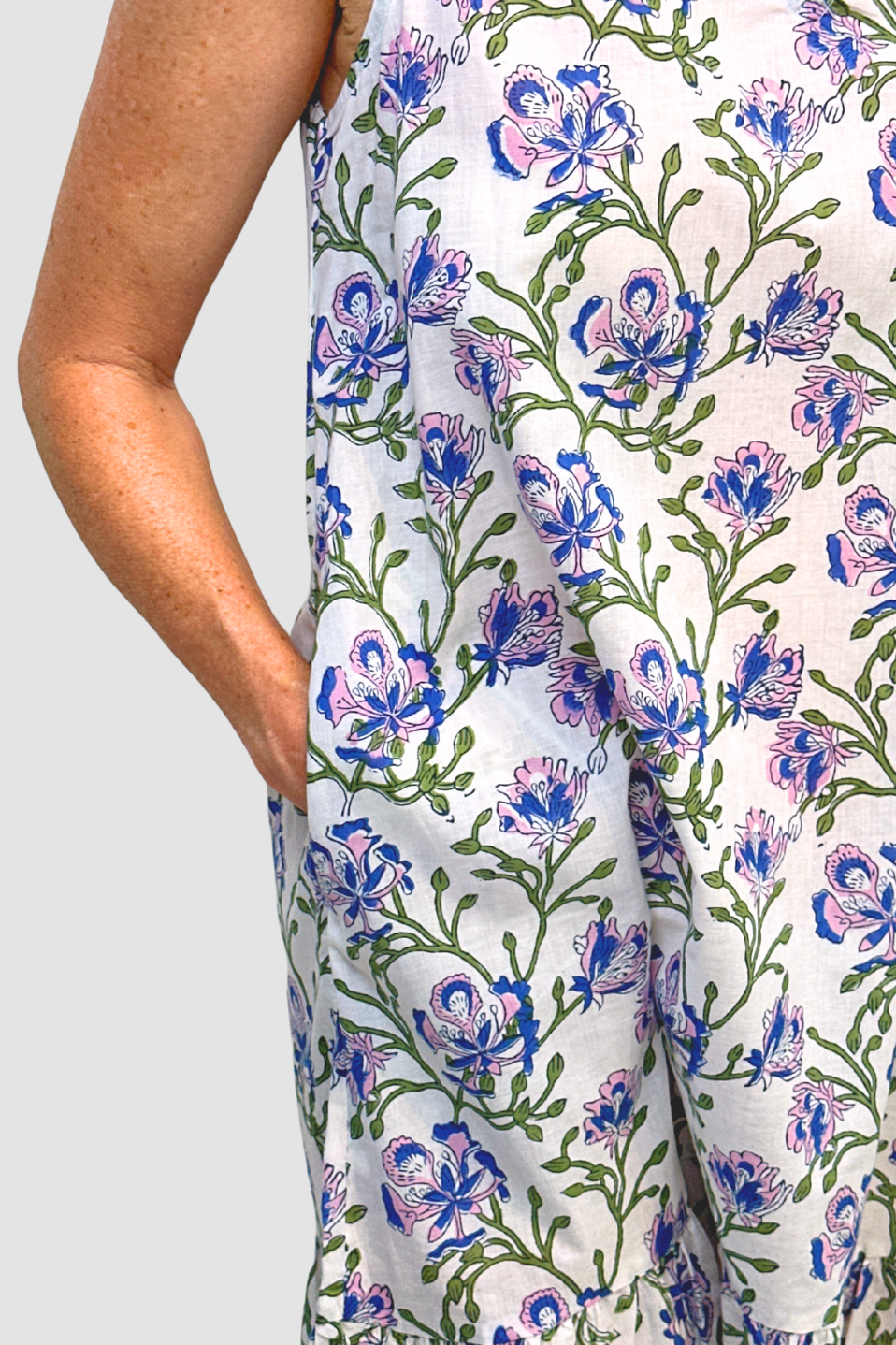 Floral patterned pants with blue and green flowers on a white background