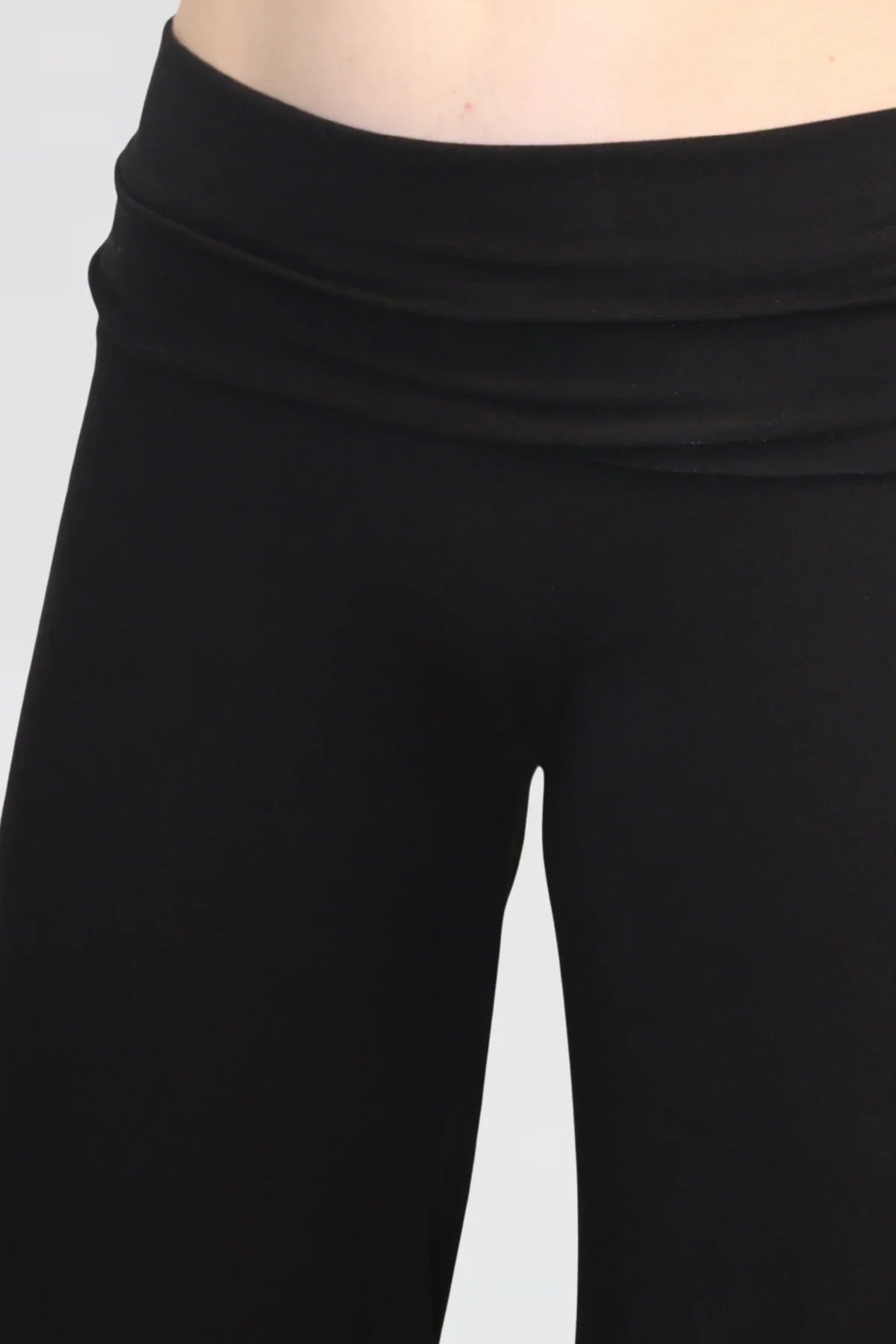 Close-up detail of Reca’s Leisure Lux Pants in black, highlighting the soft stretch waistband and smooth fabric finish.