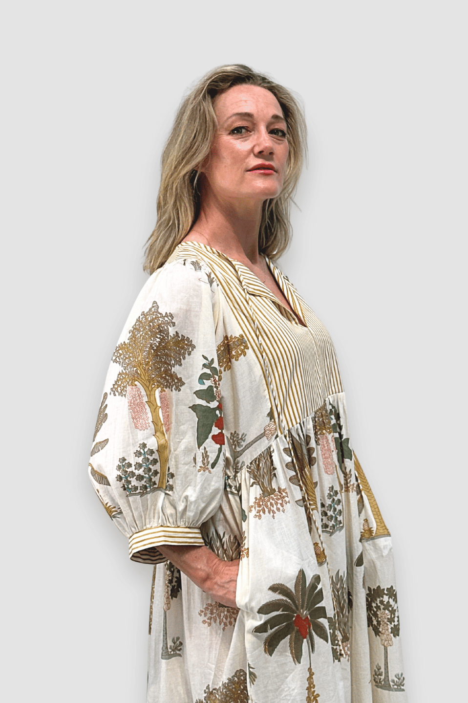 Woman wearing a Golden Canopy Cotton Midi Dress against a plain background