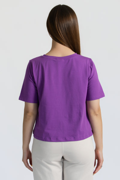 model showing the back detail of the organic flex crew tee