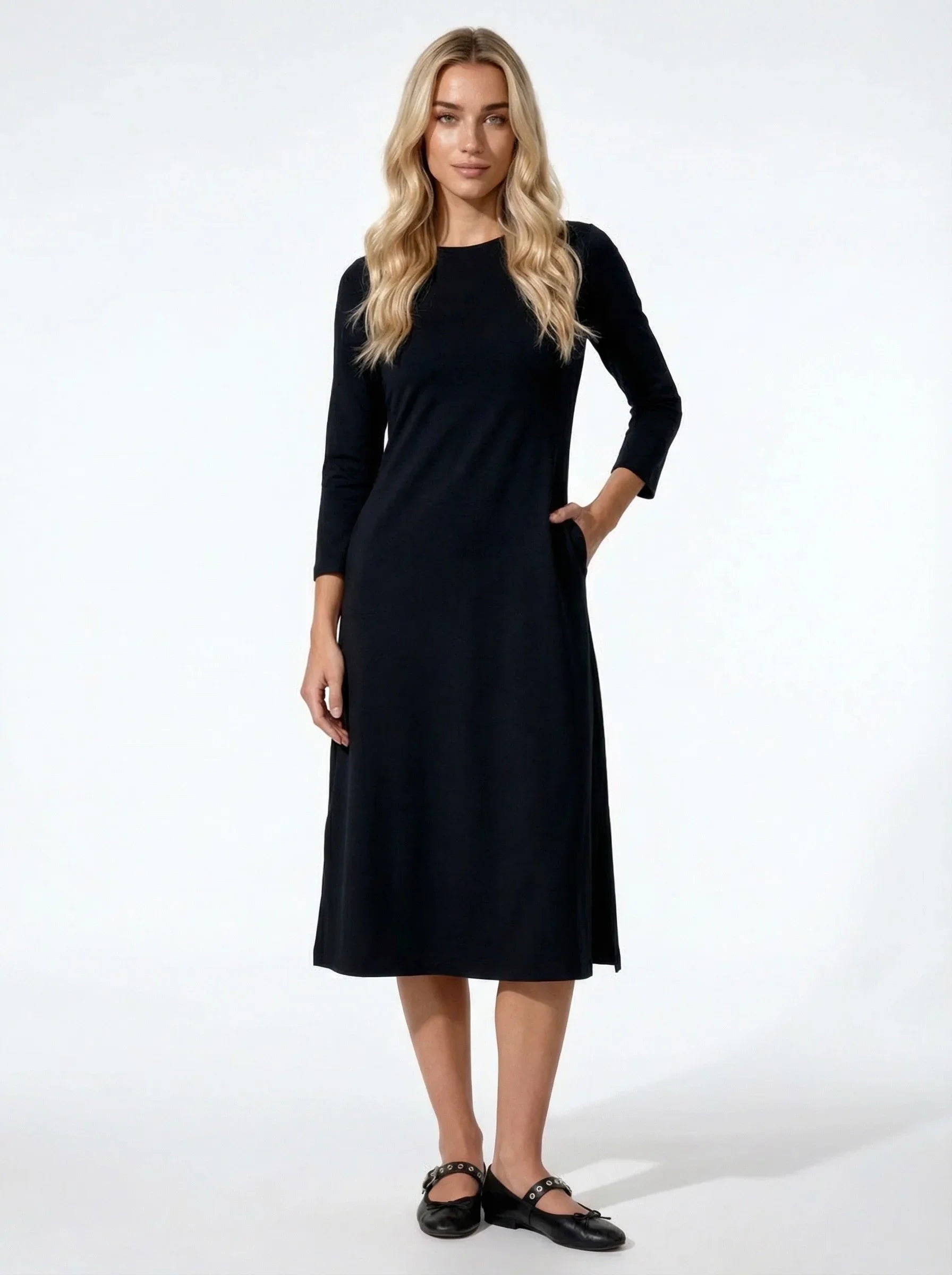 Woman wearing a black dress on a white background