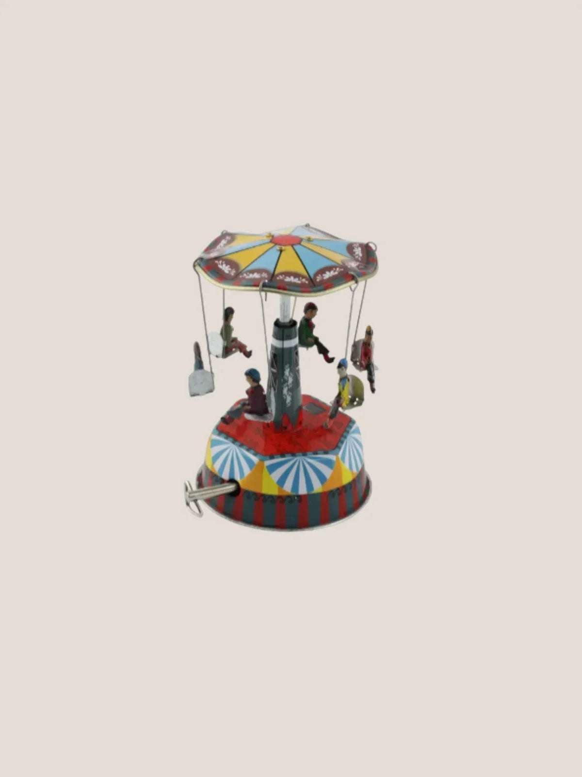 Colorful miniature carousel toy on a beige background