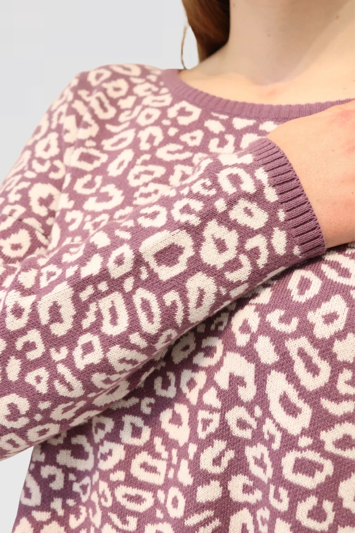 close up Cotton Jacquard Sweater - Mauve with a white leopard print pattern.