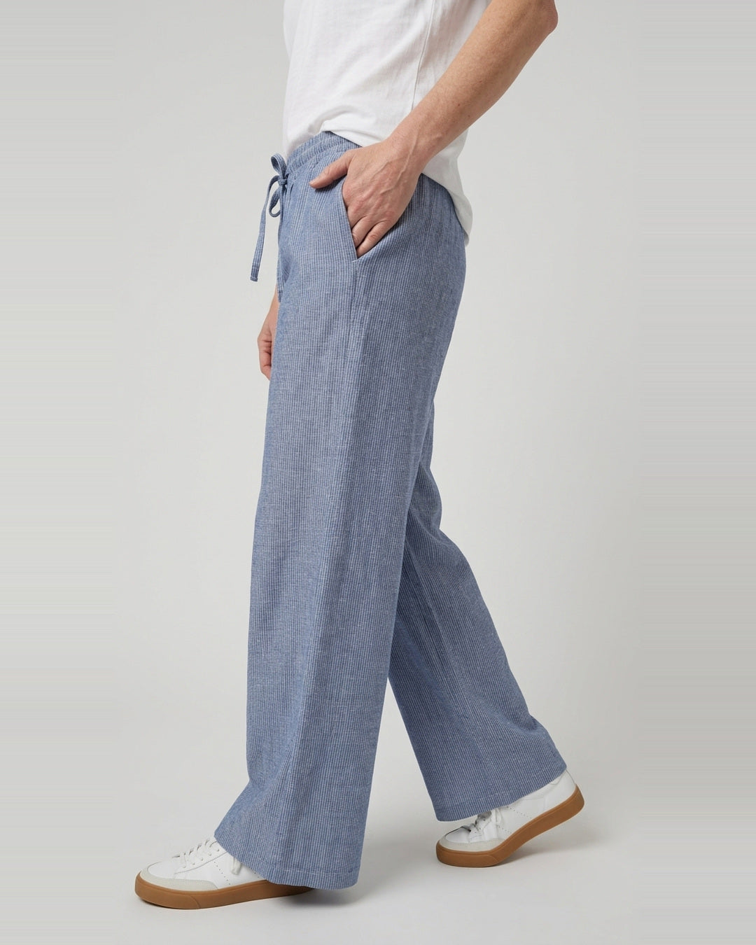 Side full-length view of the Cove Linen Cotton Pants showing the wide leg, pocket and trouser hem
