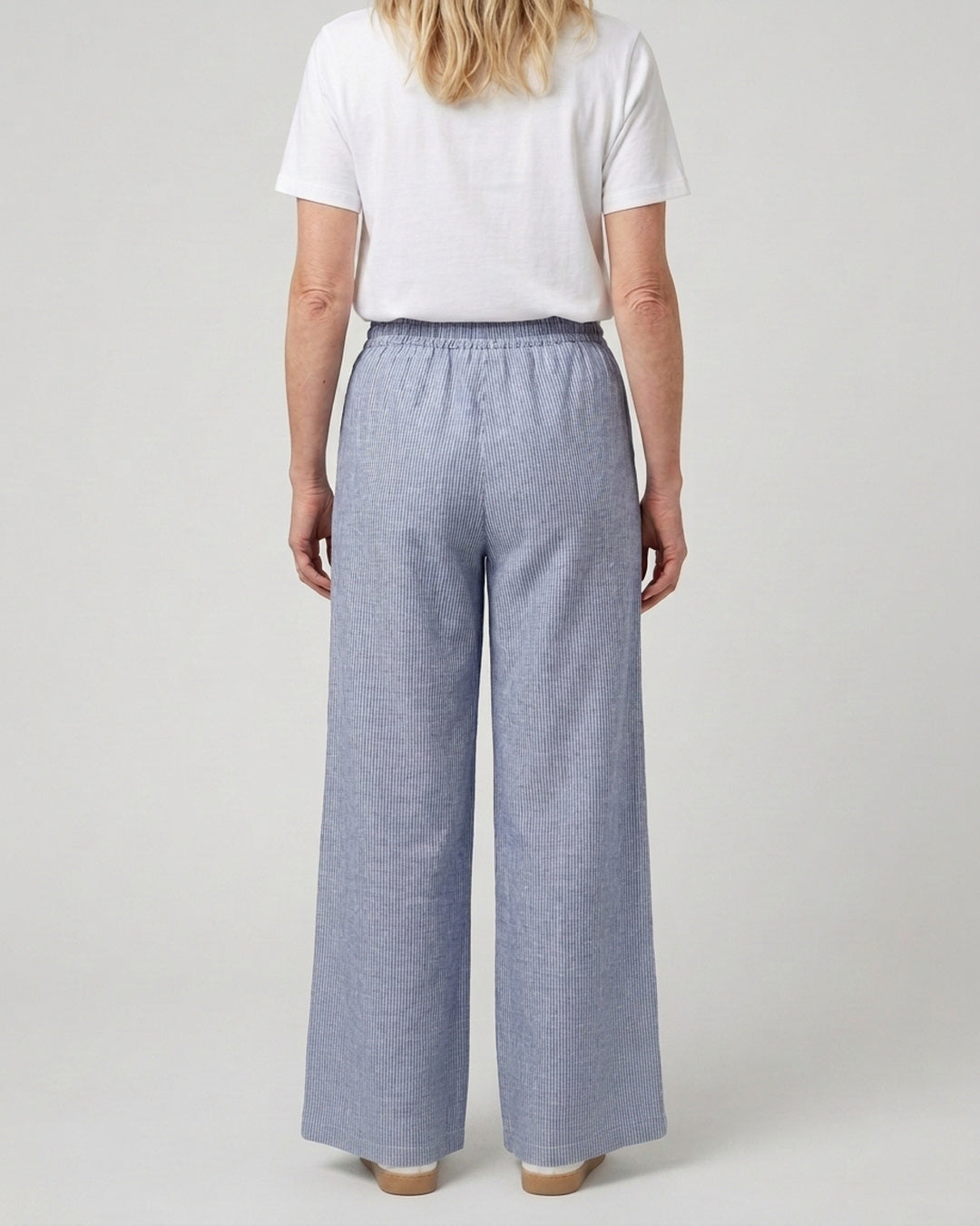 Back view of the Reca Cove Linen Cotton Pants showing the elasticated waist and wide-leg silhouette