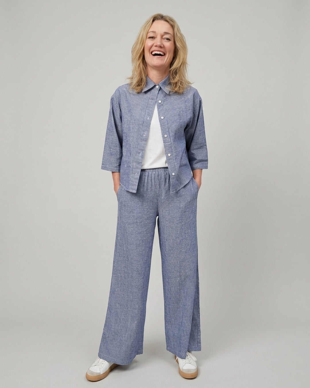 Woman wearing the matching Cove Linen Crop Shirt and wide-leg linen cotton pants, full-length front view