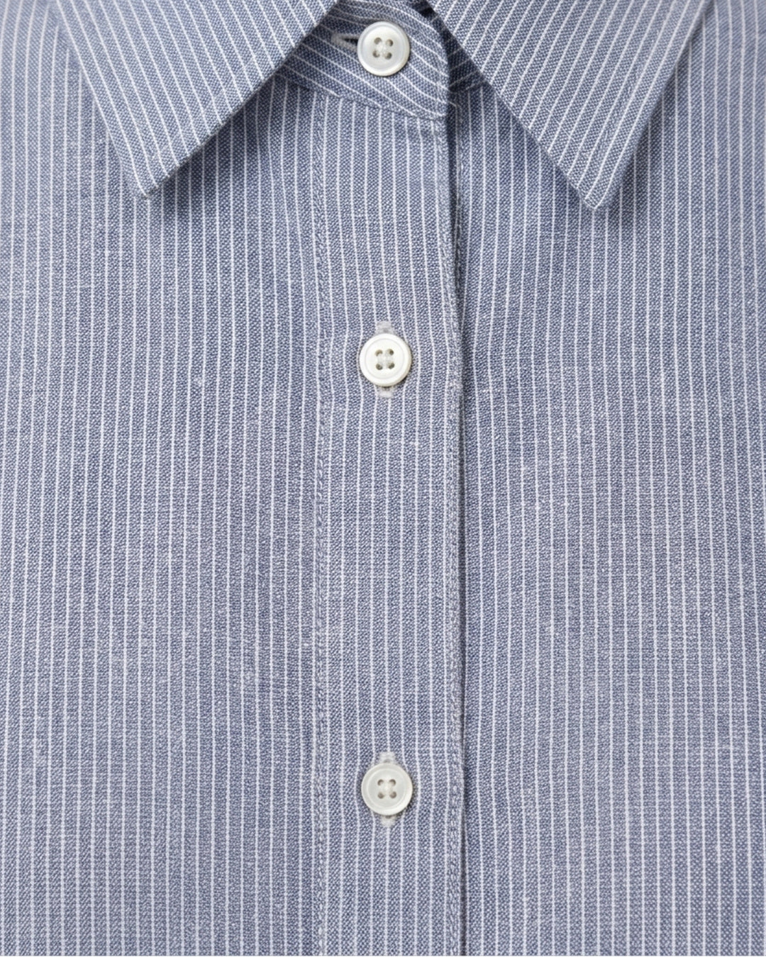 Collar and button detail of the Cove Linen Crop Shirt showing the fine blue and white stripe and white buttons