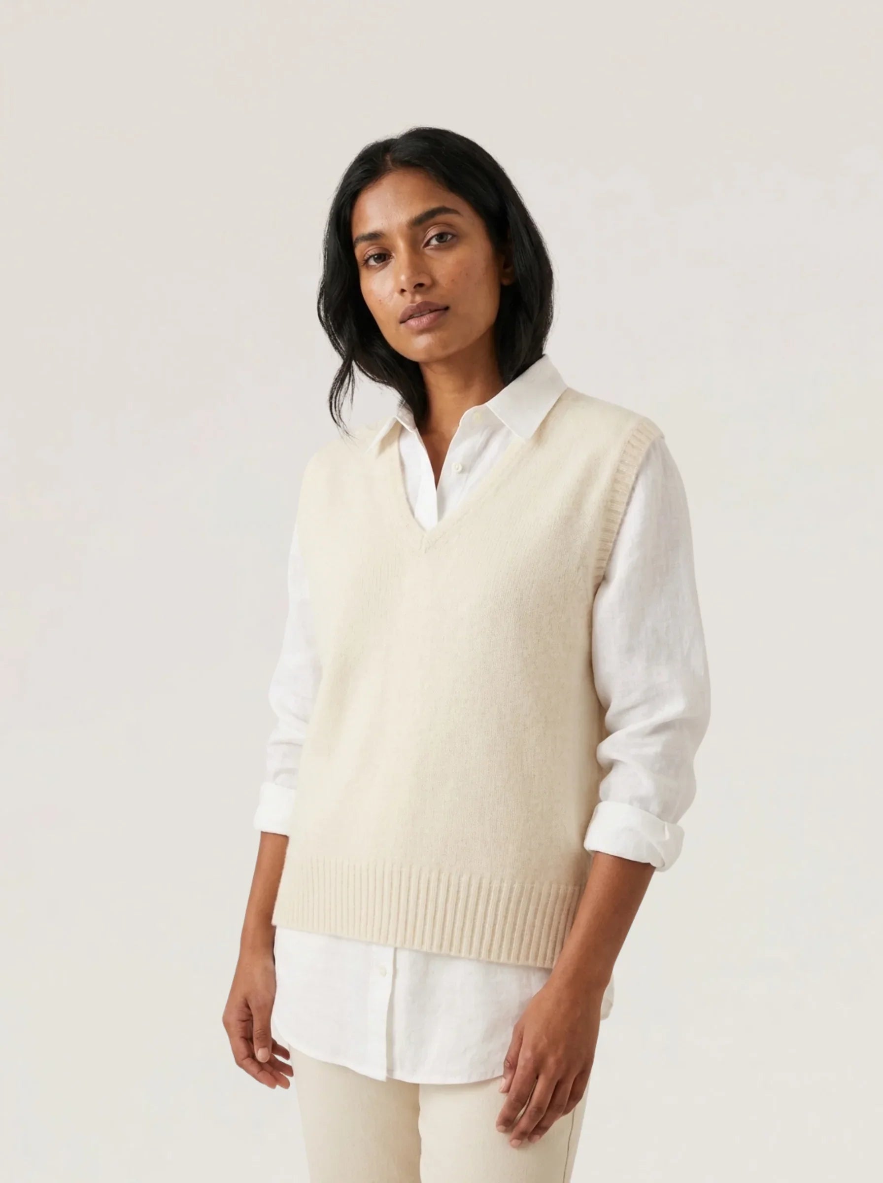 Alpaca Vital Vest in Natural cream – premium alpaca fibre V-neck knit vest layered over a white shirt