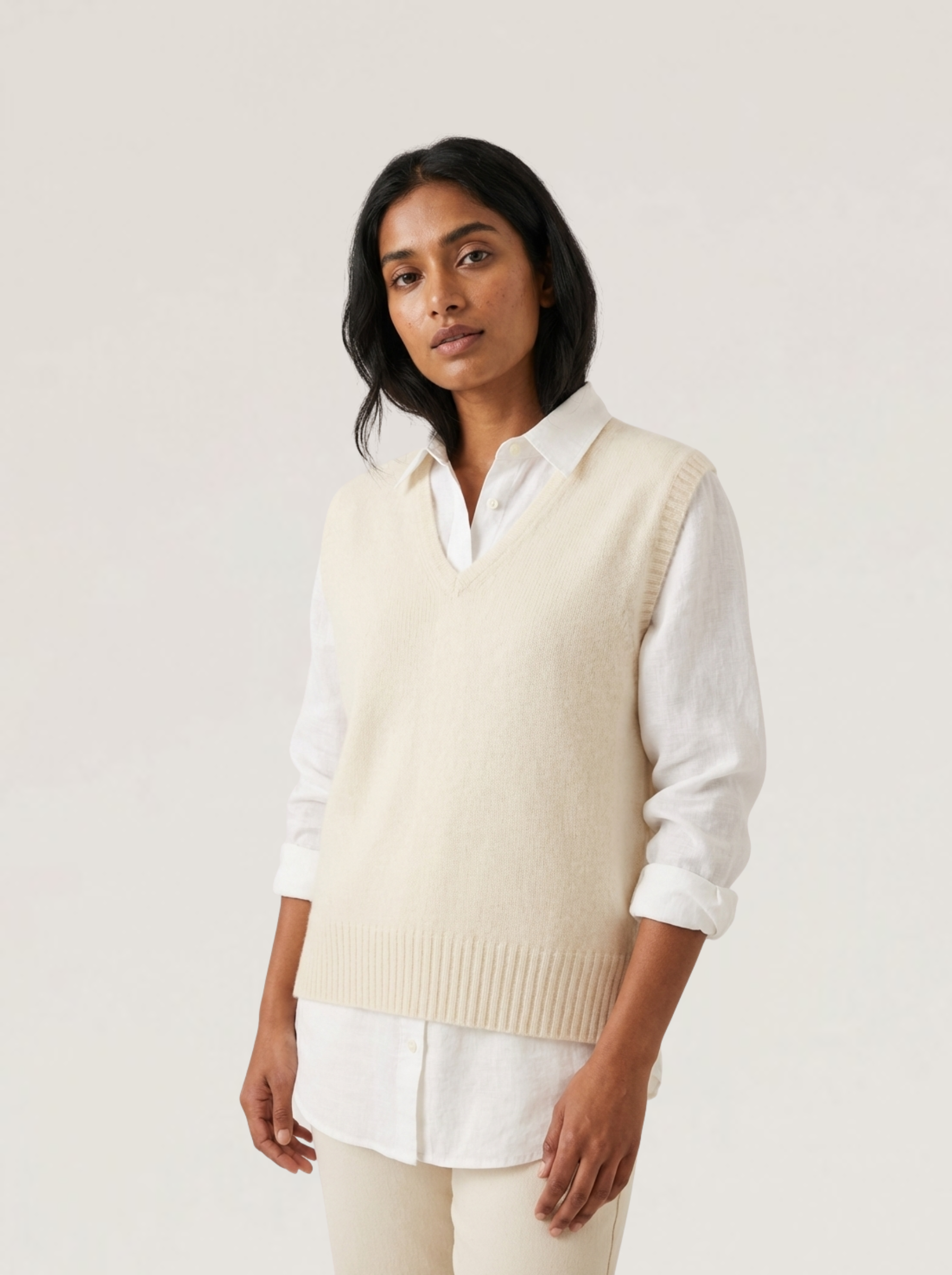 Alpaca Vital Vest in Natural cream – premium alpaca fibre V-neck knit vest layered over a white shirt