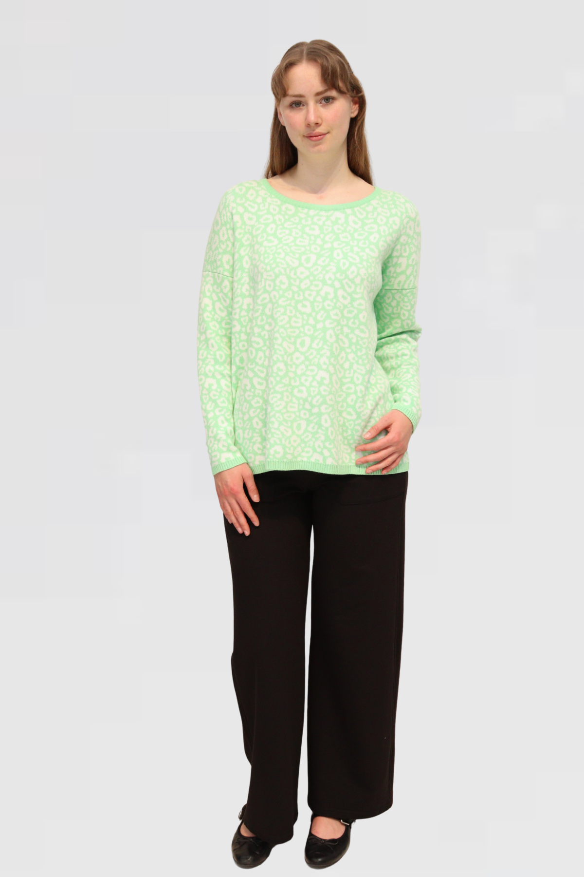 model is showcasing the front of Cotton Jacquard Sweater - Apple