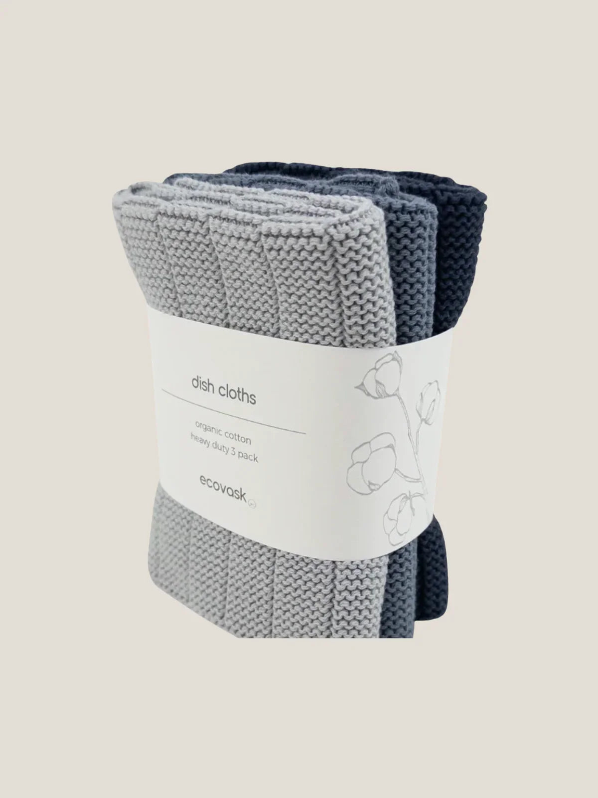Two cotton grey dish cloths with a label on a beige background