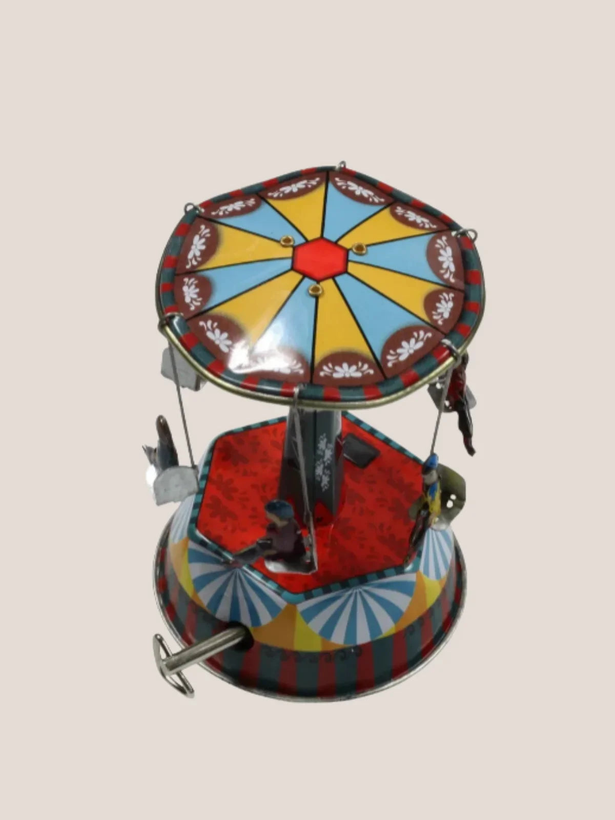 Colorful toy carousel on a beige background