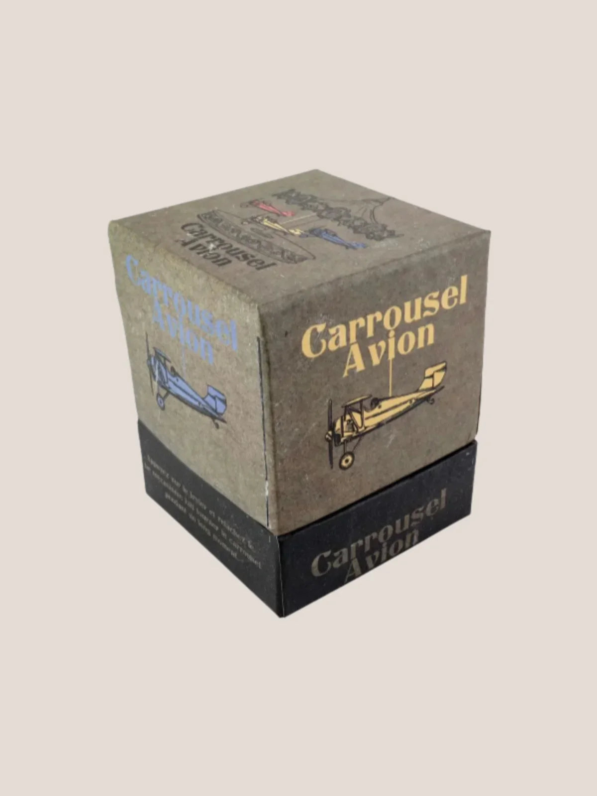 Carrousel Avion box on a beige background