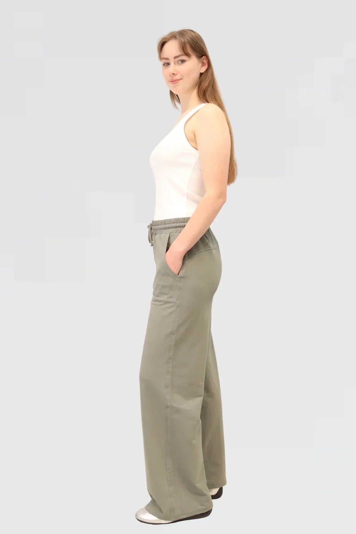 Side of Agave Drape Trousers showing drape detail and smooth fabric finish.