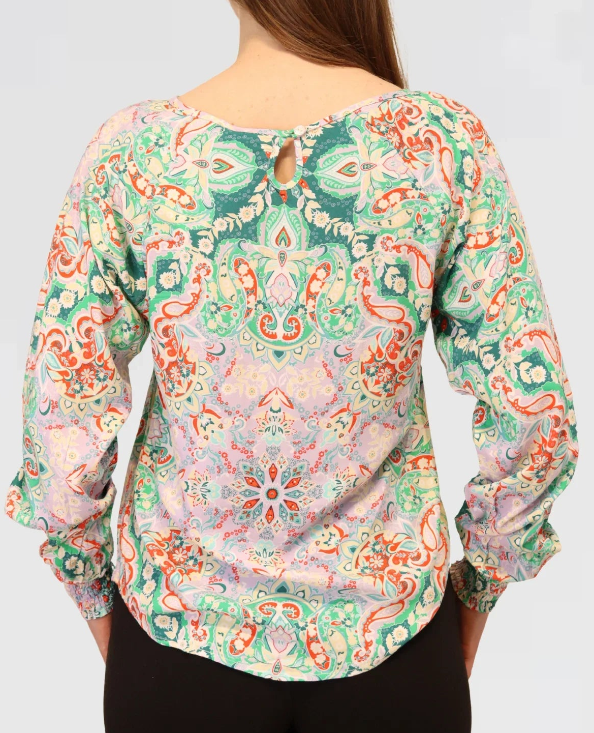 Back view of the Paisley Bloom Blouse in organic cotton, showing its relaxed drape and soft flowing silhouette.