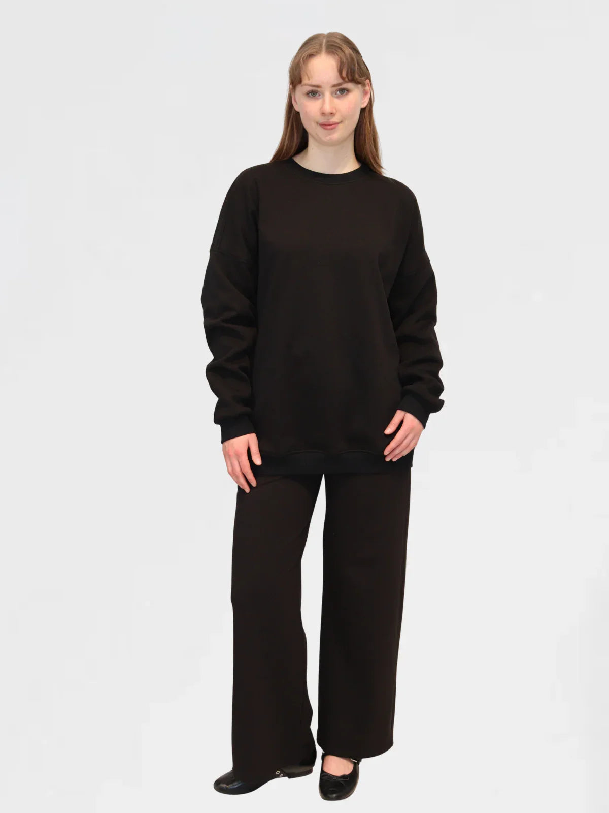 Front view of Reca Ranch Drop Sleeve Jumper in Black, relaxed fit with drop shoulder design.