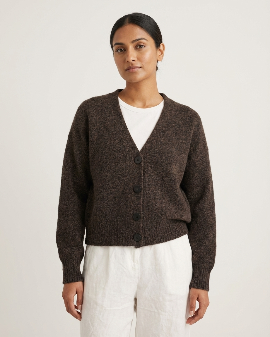 Woman wearing a V-Neck Cardigan - Brown Marl over a white cami on a light background