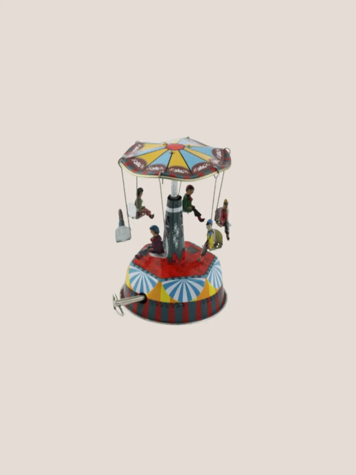 Colorful miniature carousel toy on a beige background
