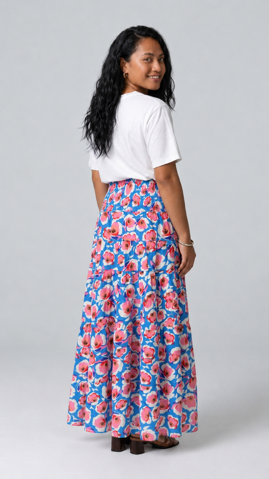 Back view of the Reca Azure Poppy Maxi Skirt showing its flowing tiered shape