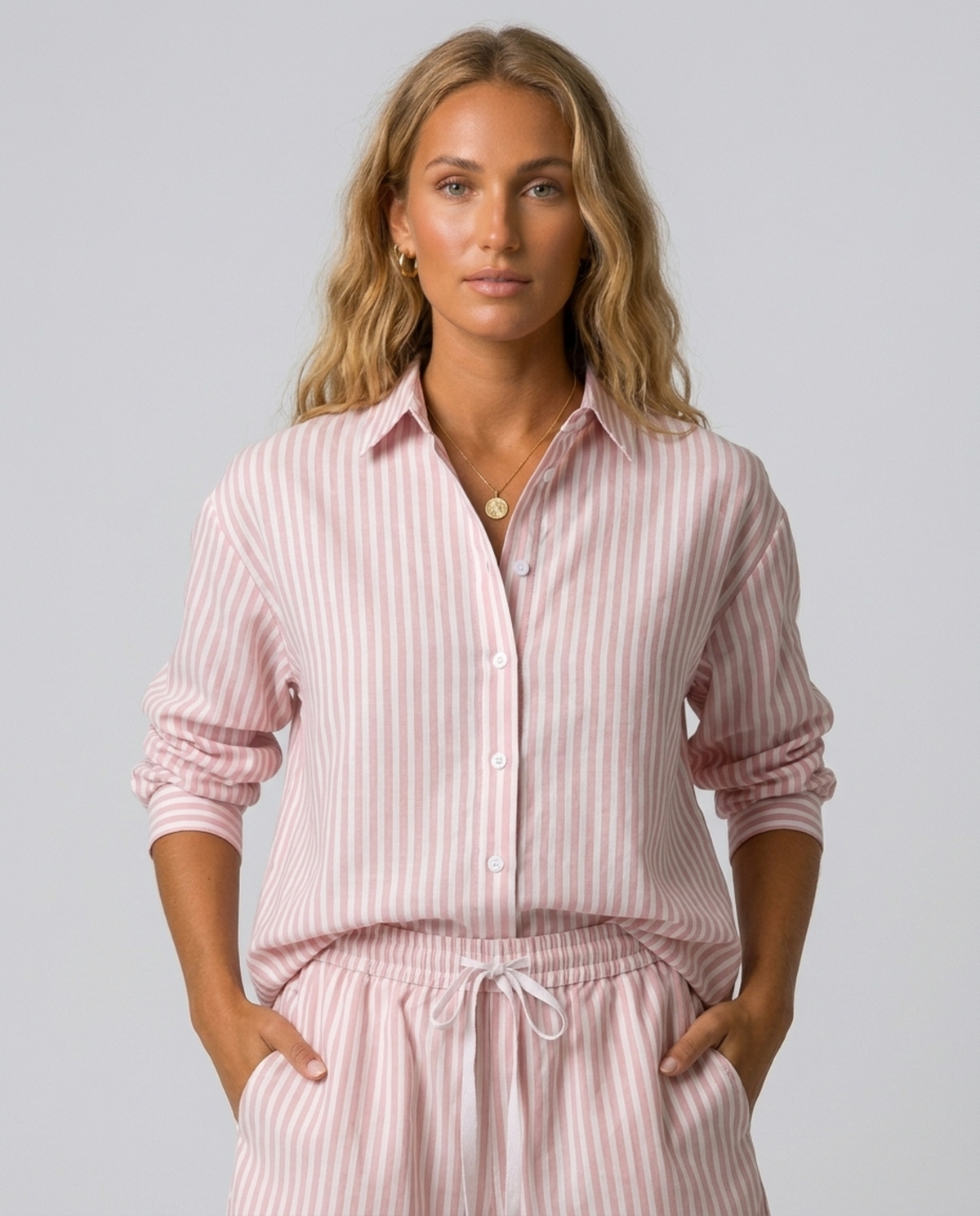 Blush Pink Stripe Cotton Shorts – front outfit view with matching shirt and hands in pockets