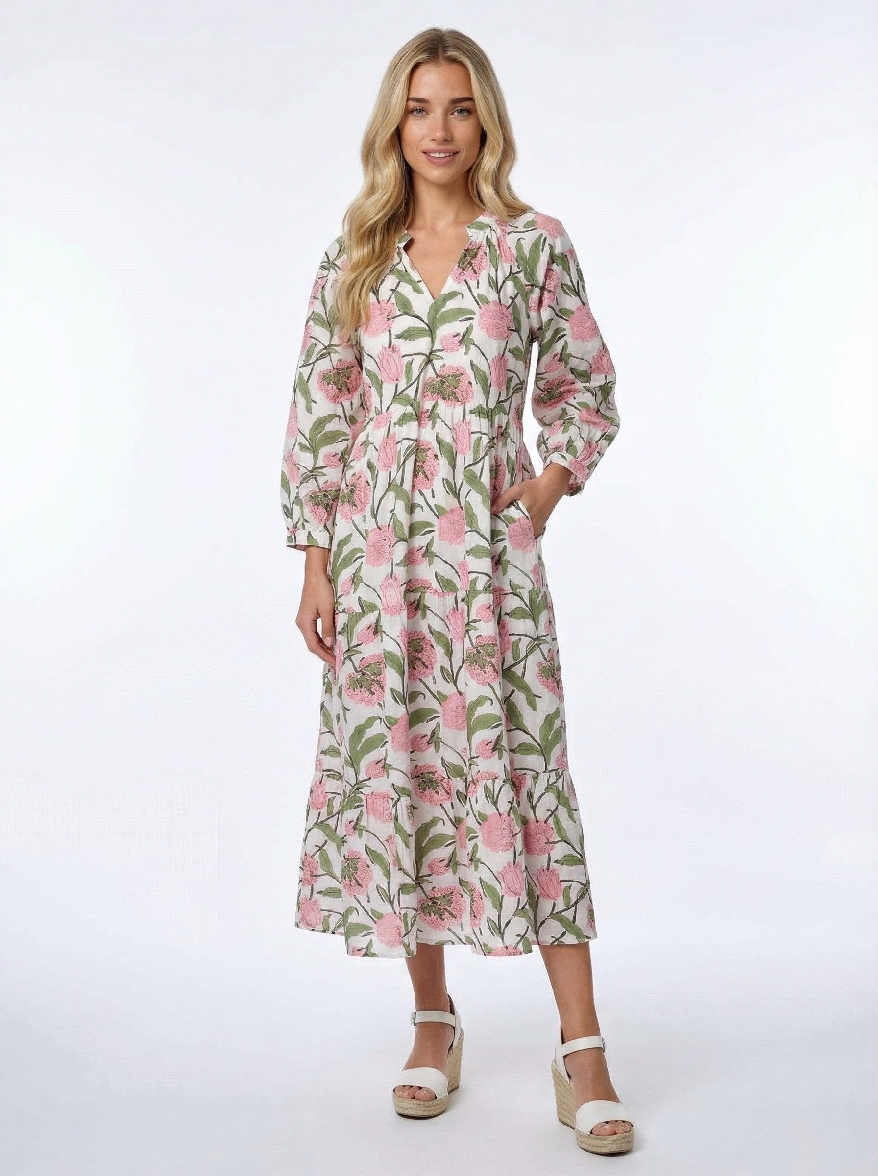 Woman wearing a floral dress on a white background