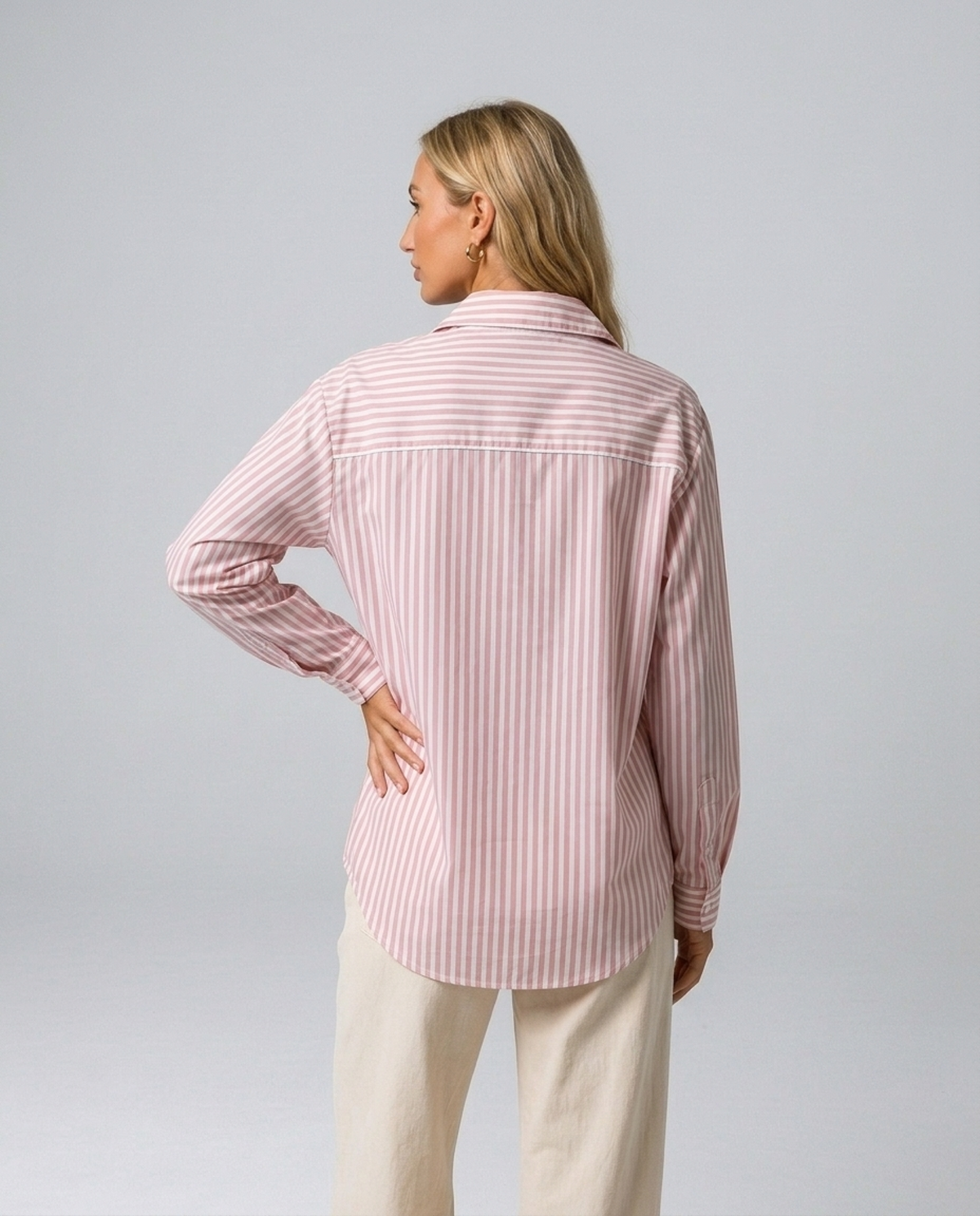 Blush Pinstripe Oversized Shirt in pink and white striped cotton blend, worn by a model