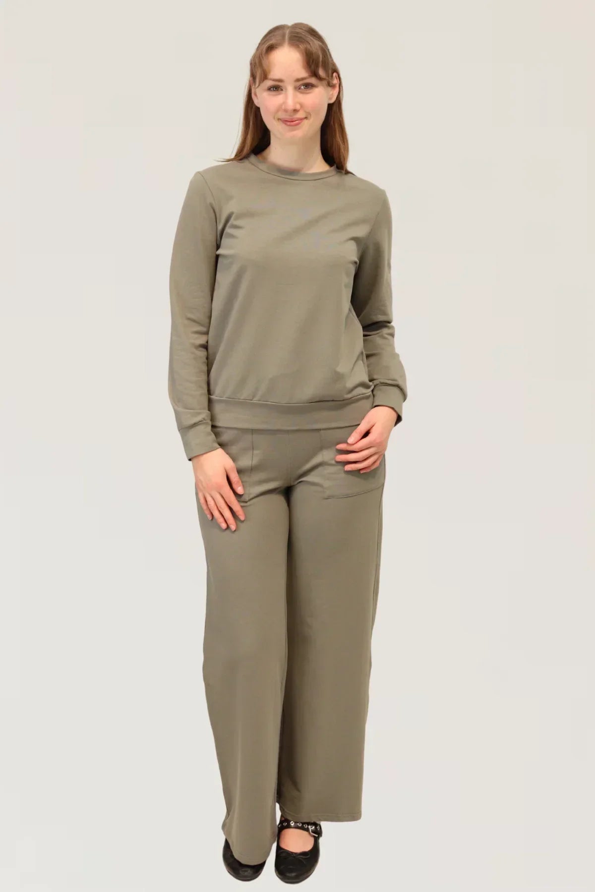Model wearing Reca Agave Drape Trousers with matching Organic Cotton Sweater, front view full outfit.
