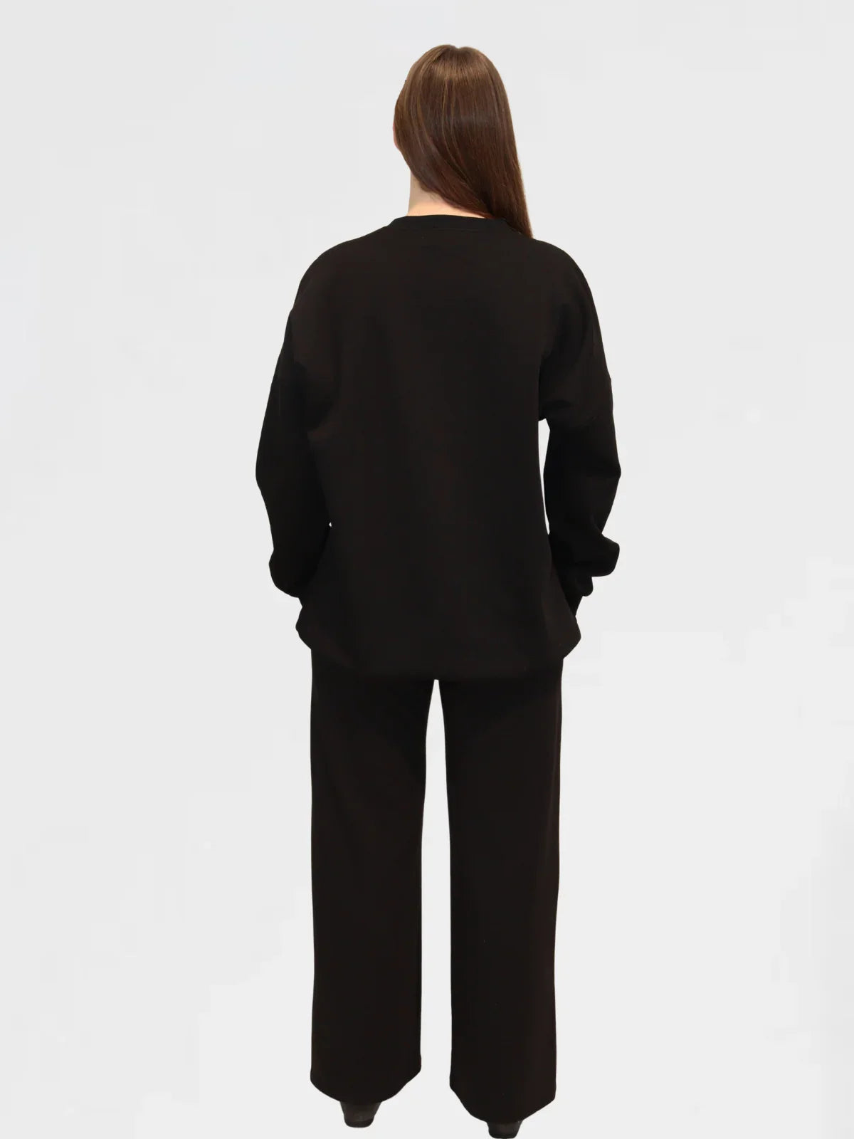 Detail shot of Ranch Drop Sleeve Jumper in Black, featuring drop shoulder seam and soft fabric texture.