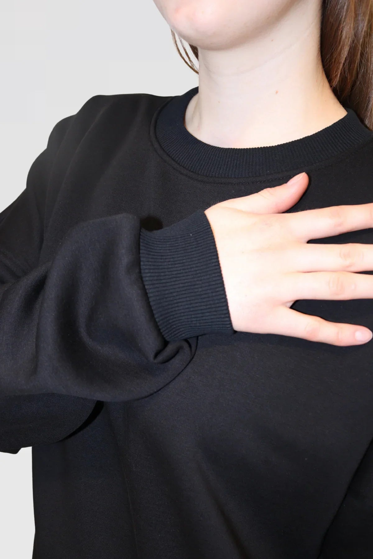 Detail shot of Ranch Drop Sleeve Jumper in Black, featuring drop shoulder seam and soft fabric texture.