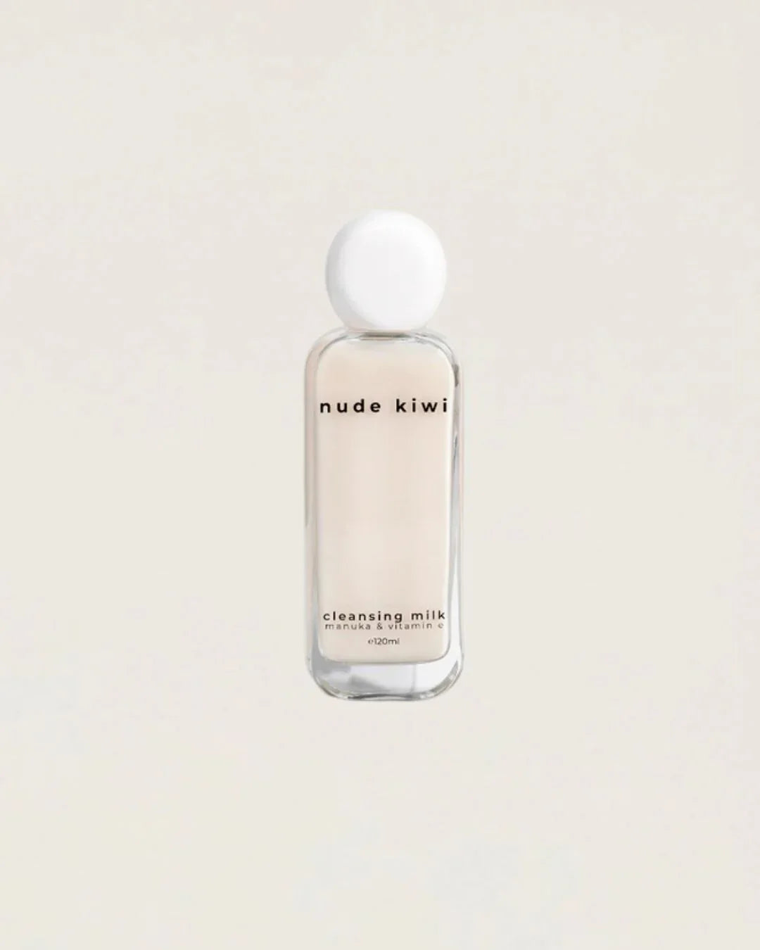 Nude Kiwi Brightening Day Cream bottle with white cap on a beige background
