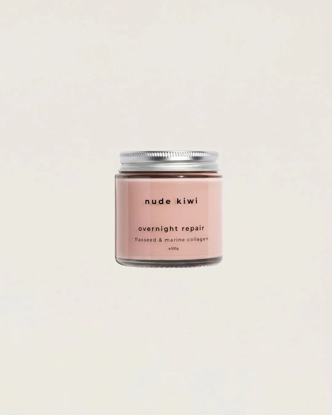 Nude Kiwi Overnight Repair night cream jar with flaxseed and marine collagen on a beige background