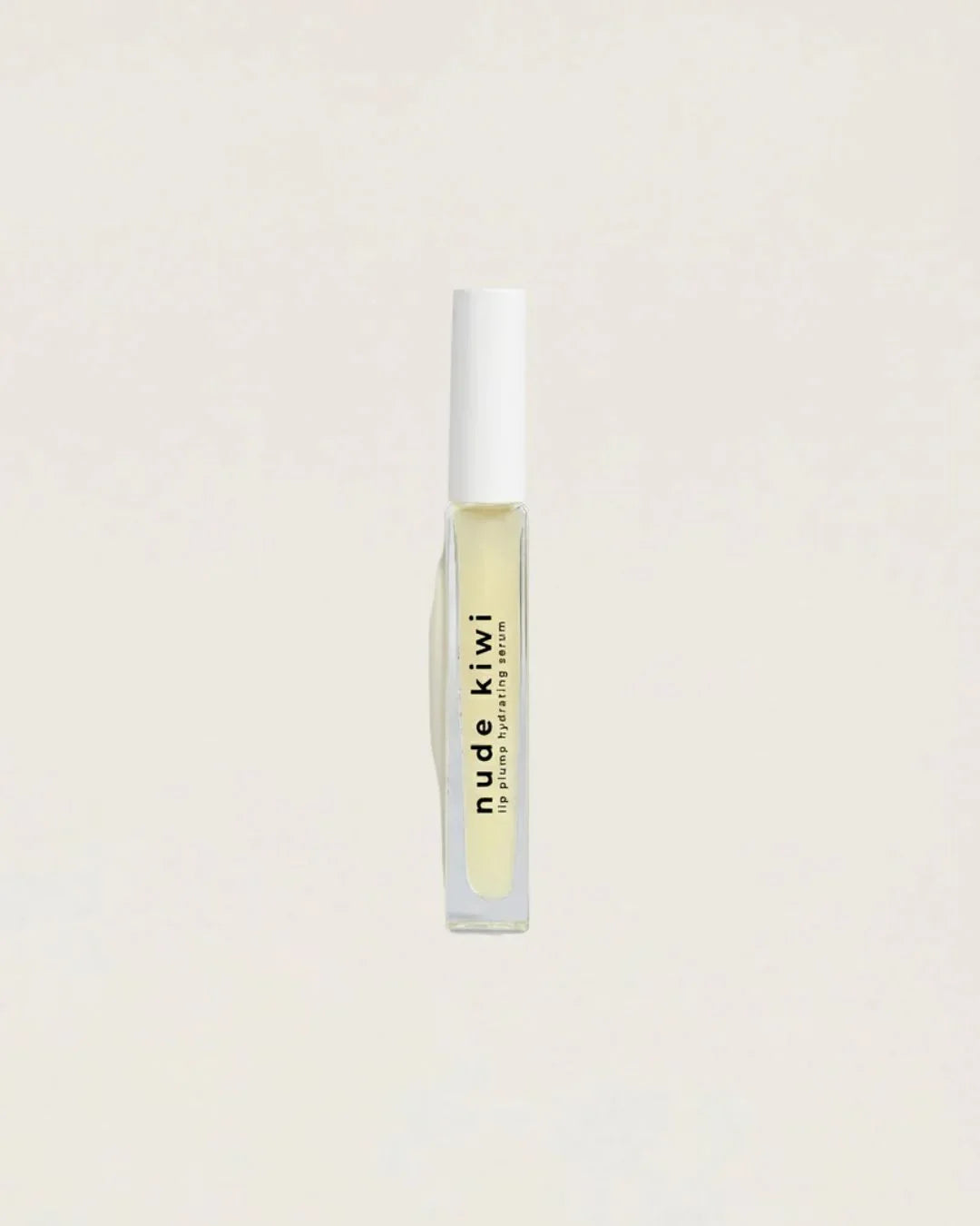 Nude Kiwi Lip Plump Hydrating Serum bottle with clear applicator on a beige background