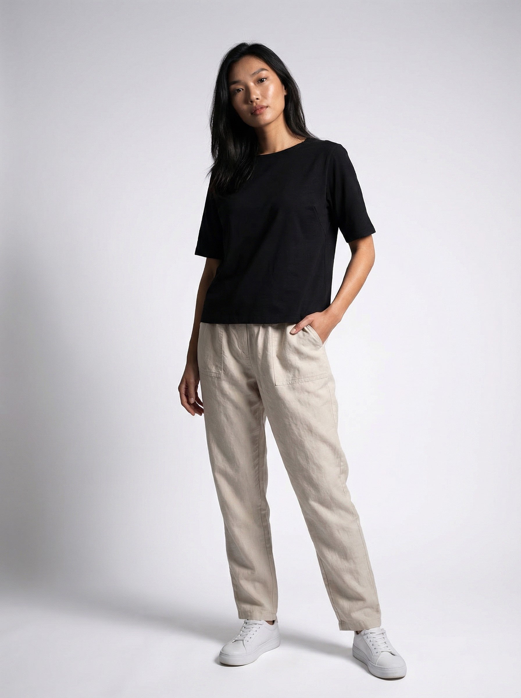 An asain model wearing black t shirt